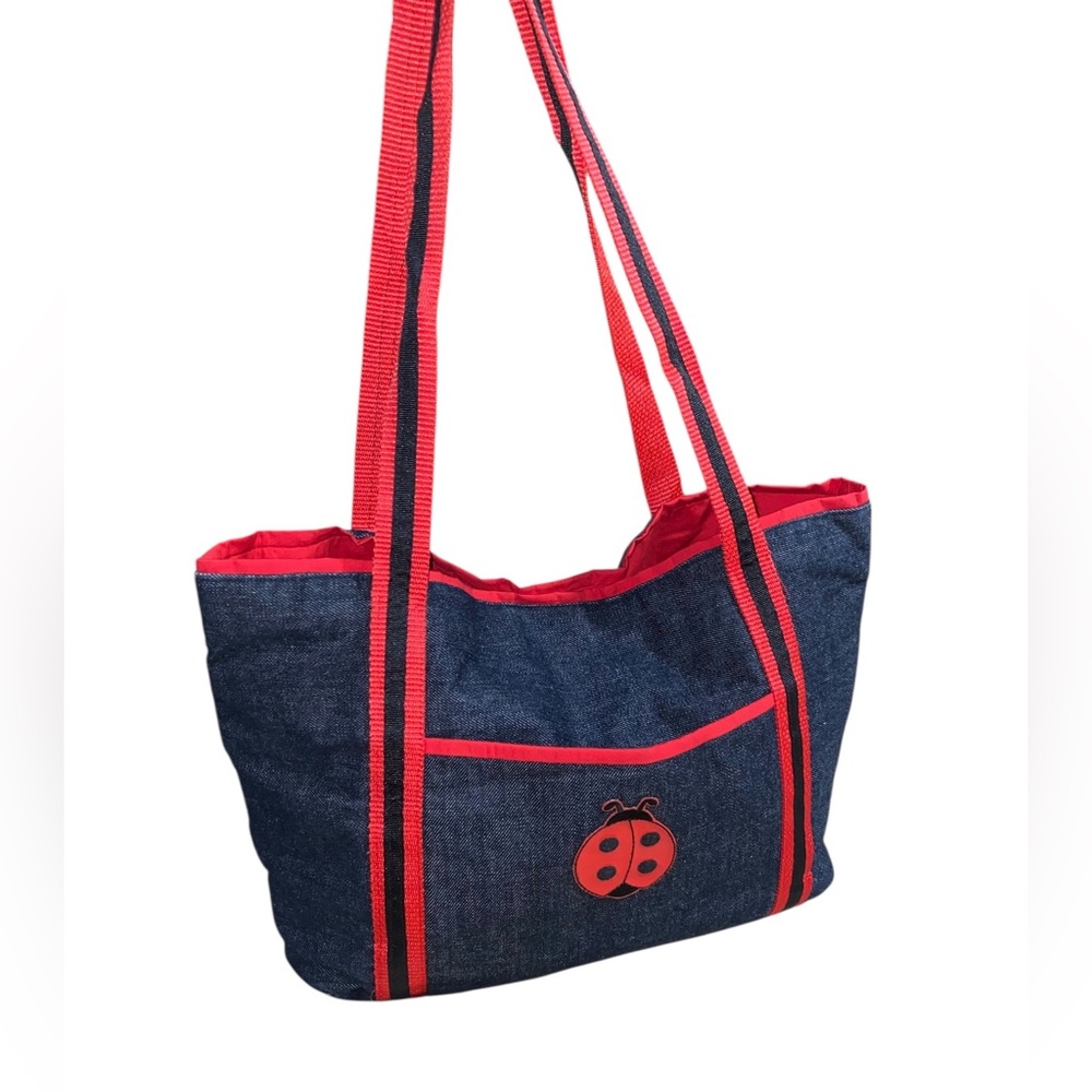 Handmade denim tote bag with red trim and a ladybug appliqué. 16”x 10”x 5” New
